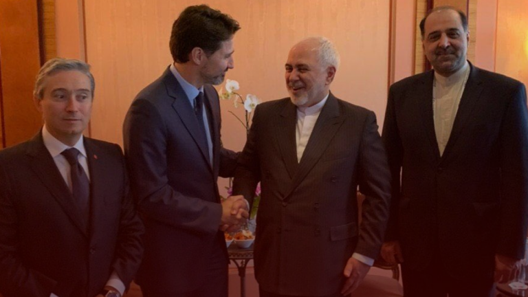 Justin Trudeau bows and shakes hands with Iranian foreign minister in photo-op
