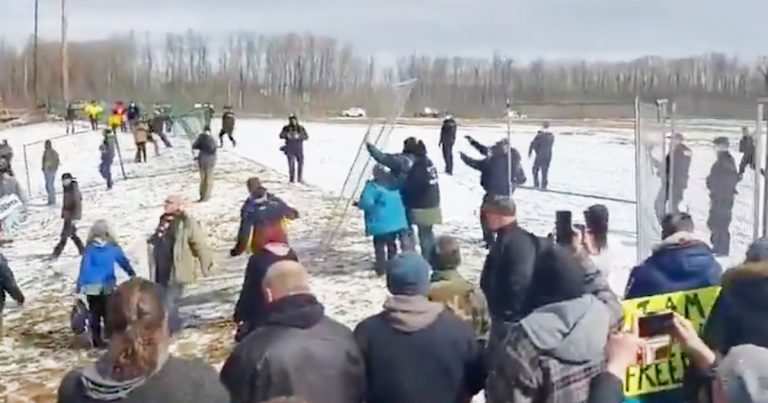 Hundreds protest closure of church by police, remove barrier