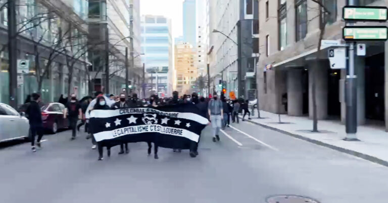 Anti-capitalism protest in Montreal sees police assaulted, windows smashed