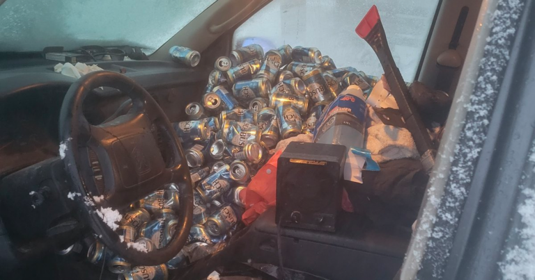 Passenger seat packed with beer cans during Ontario traffic stop