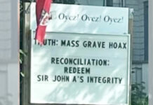P.E.I. councillor, sanctioned for “Mass graves: Hoax” lawn sign, seeks court review